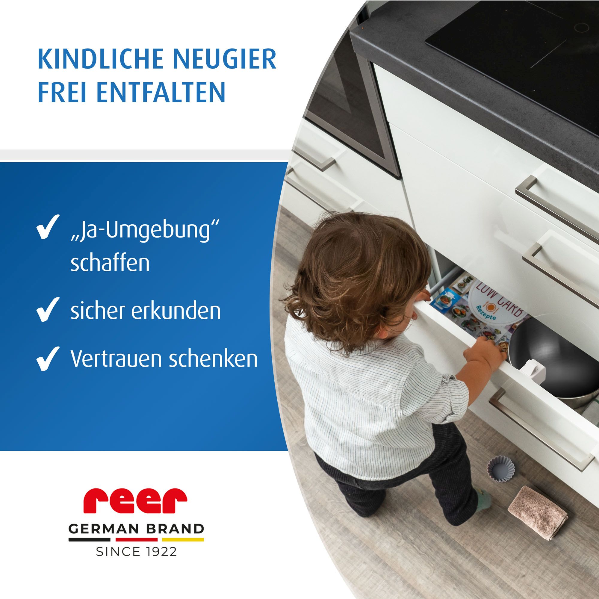 Kind an Schublade mit Schubladen-Stopp